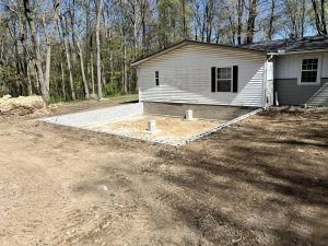 Site prepared for home addition with cinder block foundation