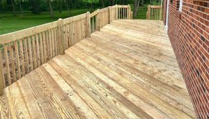 traditional brick ranch house with new deck addition light wood