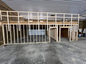 inside of pole barn with loft and finished floor and ceiling