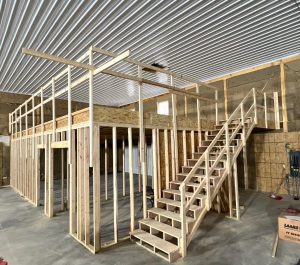 inside pole barn being built with finished ceiling view of loft