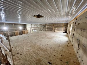 the loft area of a loft pole barn unfinished